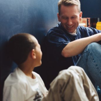 father and son sitting, positive role model.
